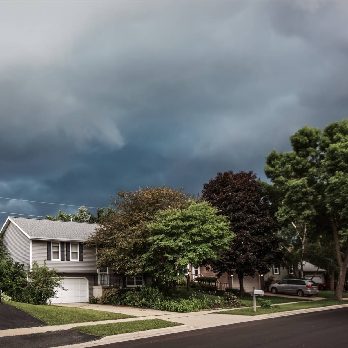 Storms that cause Kingwood roof damage gather over home