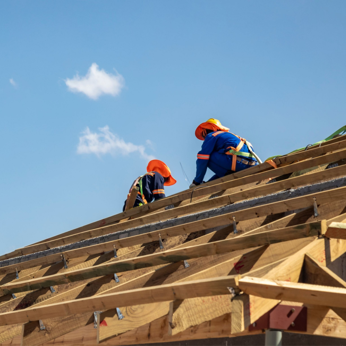 A pair of contractors conducting a Jersey Village roof replacement.