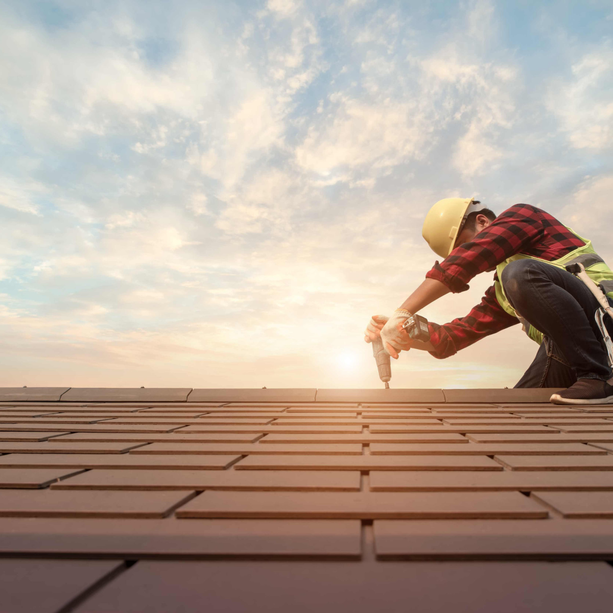 A roofer working on a roof