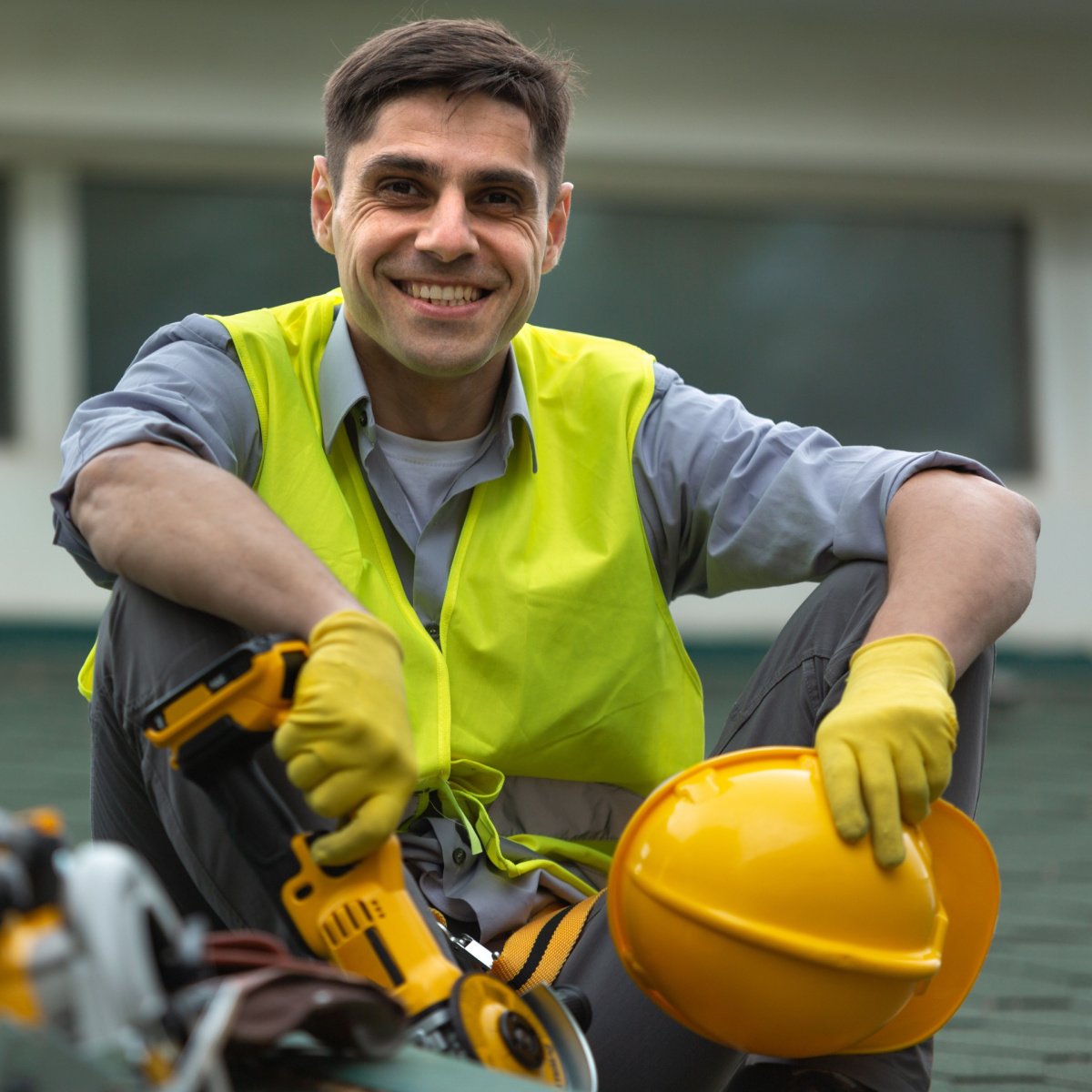 Heron lakes roofer smiling while doing a roof replacement.