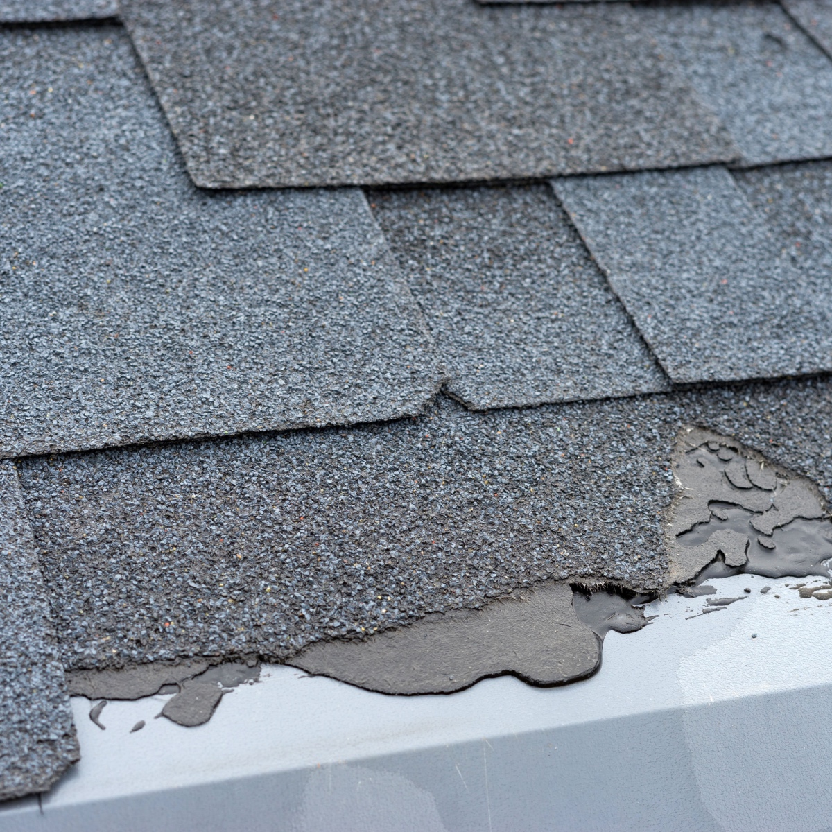 Broken shingles on Avalon roofing